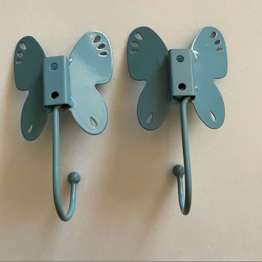 Two butterfly shaped wall hooks